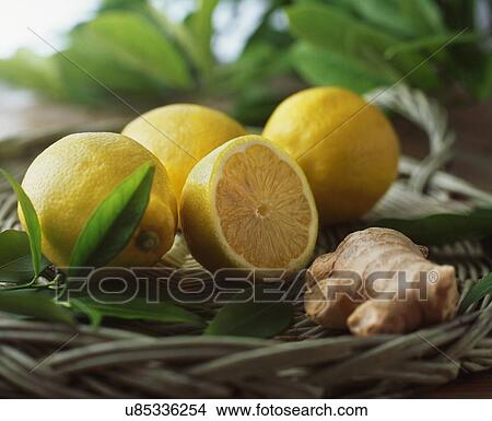 Wicker basket with fresh lemons, halved and whole, leaves and ginger View Large Photo Image Picture - Wicker basket with fresh lemons, halved and whole, leaves and ginger. Fotosearch
