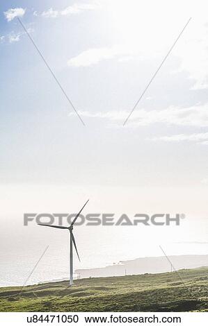 Stock Image - "Wind turbine on coastal cliff, Haleakala, Hawaii, USA". Fotosearch