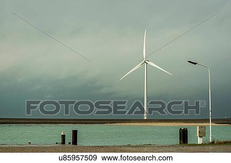 Wind turbine on dyke, Vrouwenpolder, Zeeland, The Netherlands View Large Photo Image Stock Photo - Wind turbine on dyke, Vrouwenpolder, Zeeland, The Netherlands. Fotosearch