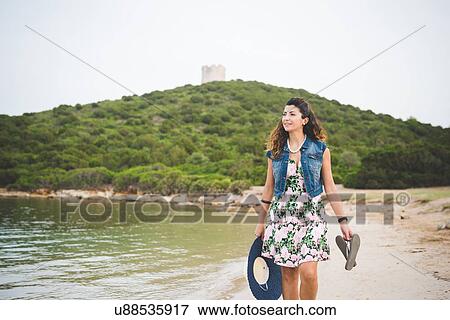 Stock Photo - Woman at coast, Alghero, Sassari, Sardinia, Italy. Fotosearch