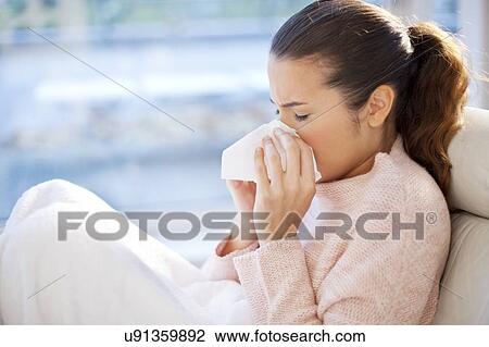 Woman blowing her nose View Large Photo Image Stock Image - Woman blowing her nose. Fotosearch