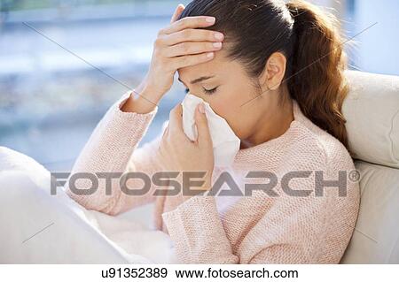 Woman blowing her nose View Large Photo Image Stock Photo - Woman blowing her nose. Fotosearch