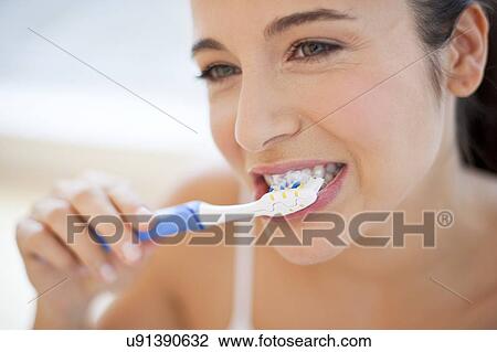 Woman brushing teeth View Large Photo Image Stock Image - Woman brushing teeth. Fotosearch