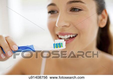 Woman brushing teeth View Large Photo Image Stock Photograph - Woman brushing teeth. Fotosearch