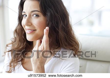 Stock Image - Woman crossing fingers. Fotosearch
