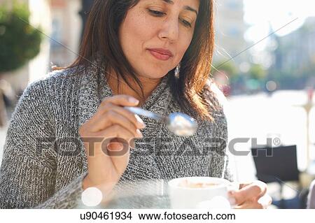 Picture - Woman having coffee. Fotosearch