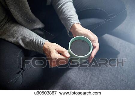 Woman having coffee View Large Photo Image Stock Photo - Woman having coffee. Fotosearch
