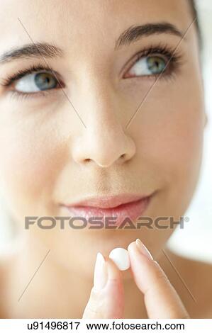 Woman holding a tablet View Large Photo Image Stock Photo - Woman holding a tablet. Fotosearch