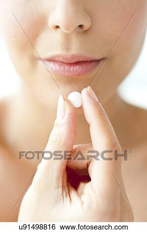 Woman holding a tablet View Large Photo Image Stock Photograph - Woman holding a tablet. Fotosearch