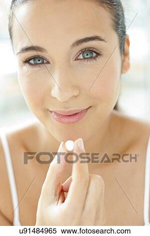 Stock Photography - Woman holding a tablet. Fotosearch