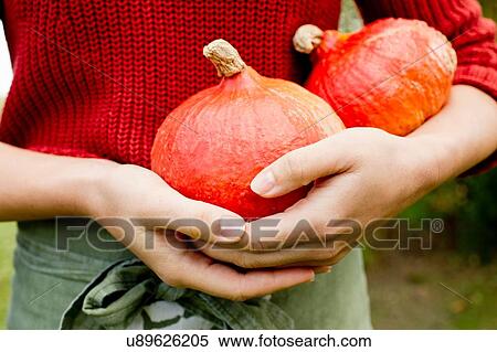 Woman holding homegrown squash View Large Photo Image Stock Photography - Woman holding homegrown squash. Fotosearch