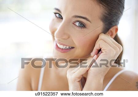 Stock Photo - Woman looking at camera. Fotosearch