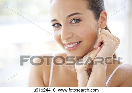 Stock Photo - Woman looking at camera. Fotosearch