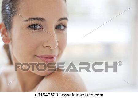 Stock Photo - Woman looking at camera. Fotosearch