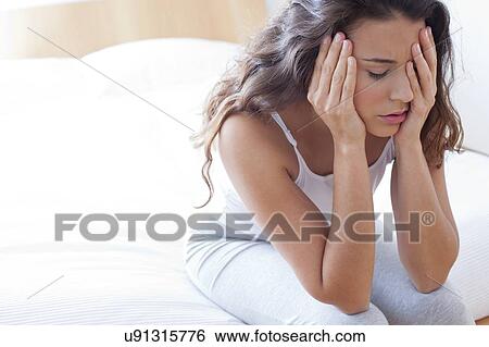Woman on bed in pain View Large Photo Image Stock Photograph - Woman on bed in pain. Fotosearch