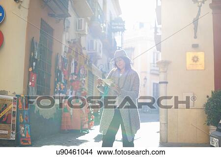 Woman sightseeing, reading map, Seville, Spain View Large Photo Image Picture - Woman sightseeing, reading map, Seville, Spain. Fotosearch