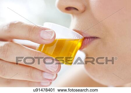 Woman taking medicine View Large Photo Image Stock Image - Woman taking medicine. Fotosearch