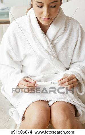 Woman taking pregnancy test View Large Photo Image Picture - Woman taking pregnancy test. Fotosearch