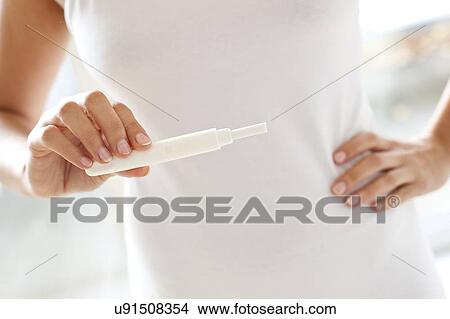 Woman taking pregnancy test View Large Photo Image Picture - Woman taking pregnancy test. Fotosearch