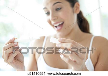 Woman taking pregnancy test View Large Photo Image Picture - Woman taking pregnancy test. Fotosearch