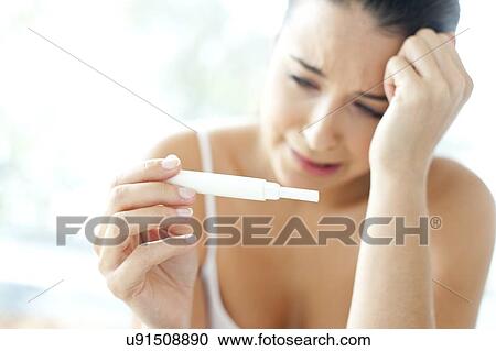 Woman taking pregnancy test View Large Photo Image Stock Image - Woman taking pregnancy test. Fotosearch