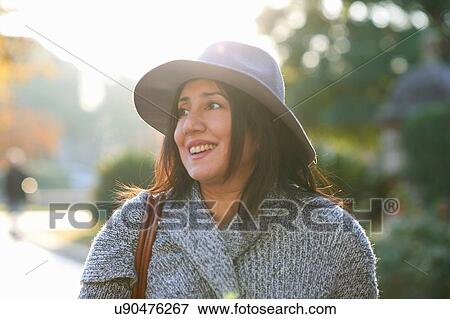 Woman walking in park View Large Photo Image Stock Photo - Woman walking in park. Fotosearch