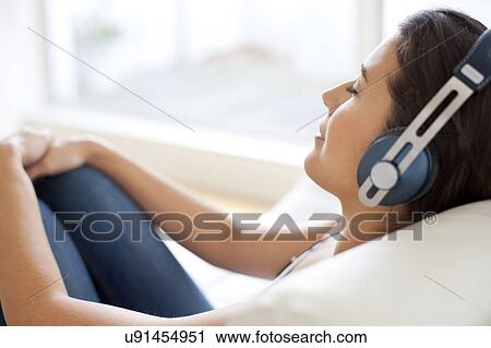Woman wearing headphones View Large Photo Image Stock Image - Woman wearing headphones. Fotosearch