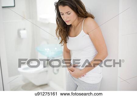 Woman with cramps View Large Photo Image Stock Image - Woman with cramps. Fotosearch