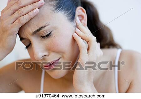 Picture - Woman with earache. Fotosearch