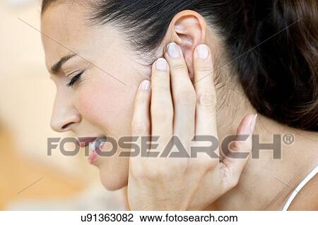 Woman with earache View Large Photo Image Stock Image - Woman with earache. Fotosearch