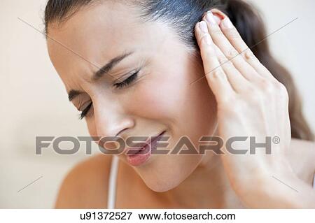 Stock Photo - Woman with earache. Fotosearch