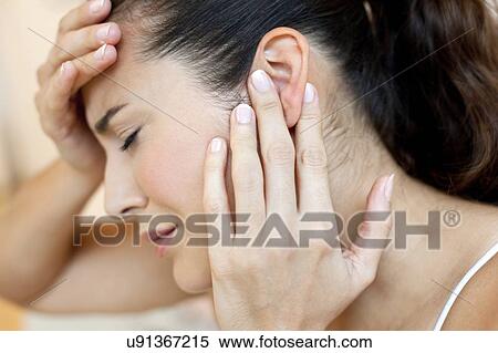 Stock Photography - Woman with earache. Fotosearch