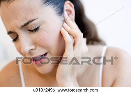 Stock Photography - Woman with earache. Fotosearch