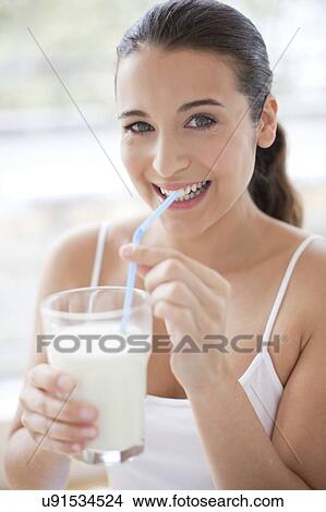 Picture - Woman with glass of milk. Fotosearch
