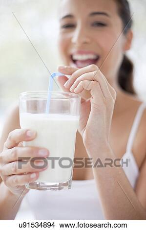 Picture - Woman with glass of milk. Fotosearch