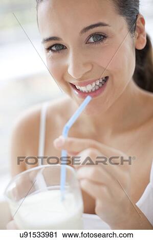Woman with glass of milk View Large Photo Image Stock Image - Woman with glass of milk. Fotosearch