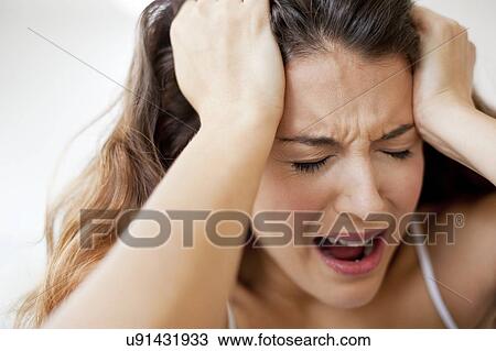 Woman with hands in hair View Large Photo Image Stock Image - Woman with hands in hair. Fotosearch