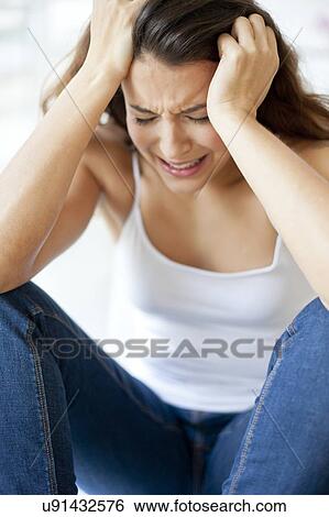 Woman with hands in hair View Large Photo Image Stock Photograph - Woman with hands in hair. Fotosearch