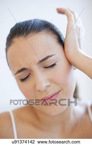 Woman with headache View Large Photo Image Stock Image - Woman with headache. Fotosearch