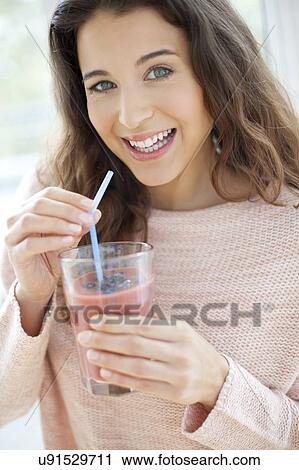 Woman with smoothie View Large Photo Image Stock Image - Woman with smoothie. Fotosearch