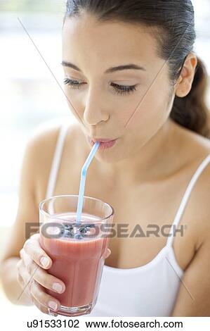 Woman with smoothie View Large Photo Image Stock Image - Woman with smoothie. Fotosearch