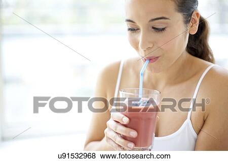 Stock Photo - Woman with smoothie. Fotosearch