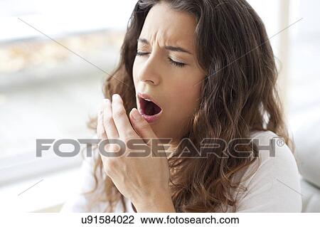 Stock Image - Woman yawning. Fotosearch
