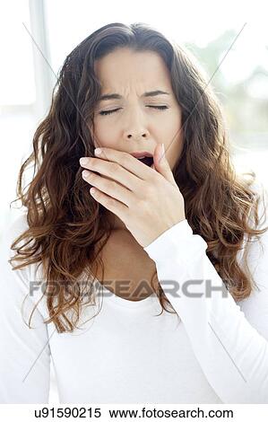 Woman yawning View Large Photo Image Stock Photography - Woman yawning. Fotosearch
