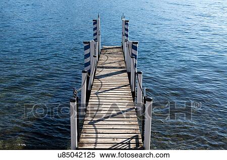 Stock Photography - Wooden pier, Lake Como, Italy. Fotosearch