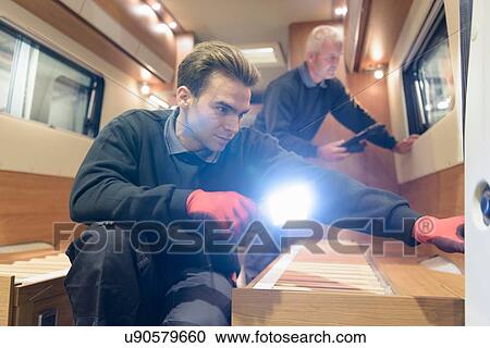 Workers inspecting vehicle on motorhome production line View Large Photo Image Stock Image - Workers inspecting vehicle on motorhome production line. Fotosearch