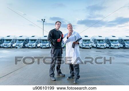 Workers inspecting vehicles on motorhome production line View Large Photo Image Stock Photo - Workers inspecting vehicles on motorhome production line. Fotosearch
