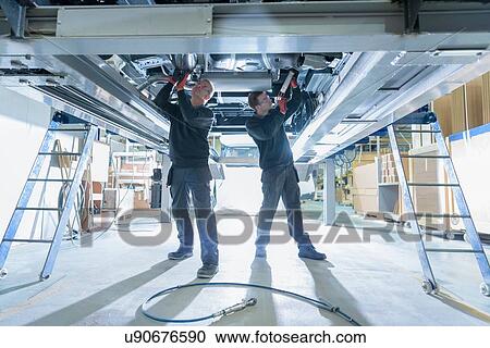 Workers on motorhome production line View Large Photo Image Stock Image - Workers on motorhome production line. Fotosearch