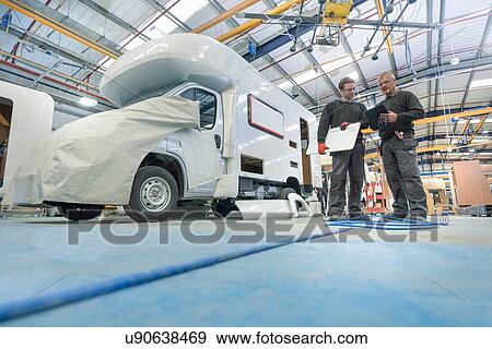 Workers on motorhome production line View Large Photo Image Stock Photo - Workers on motorhome production line. Fotosearch