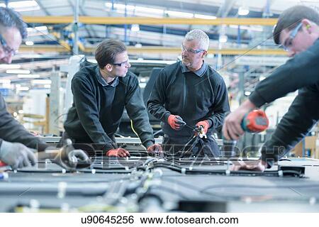 Workers on motorhome production line View Large Photo Image Stock Photograph - Workers on motorhome production line. Fotosearch